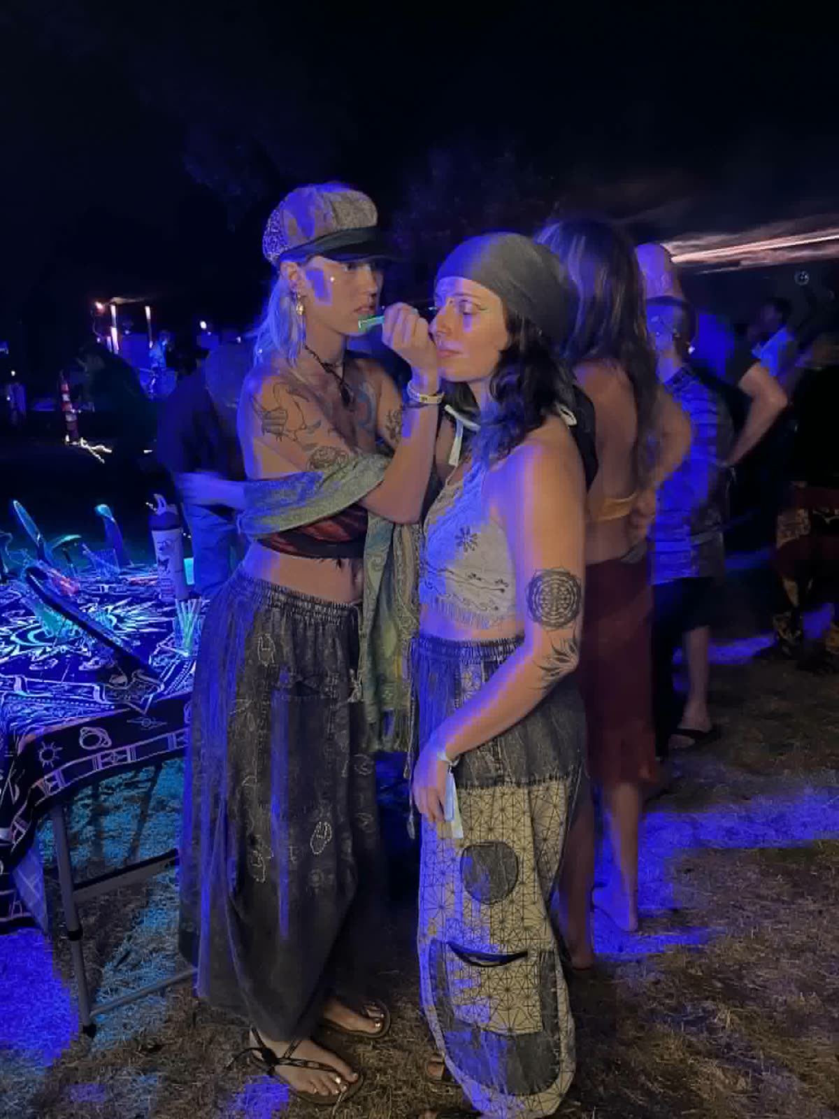 Applying Mothership UV markers at a festival